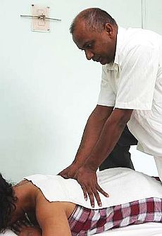 Soogumar Krishnan giving a back massage